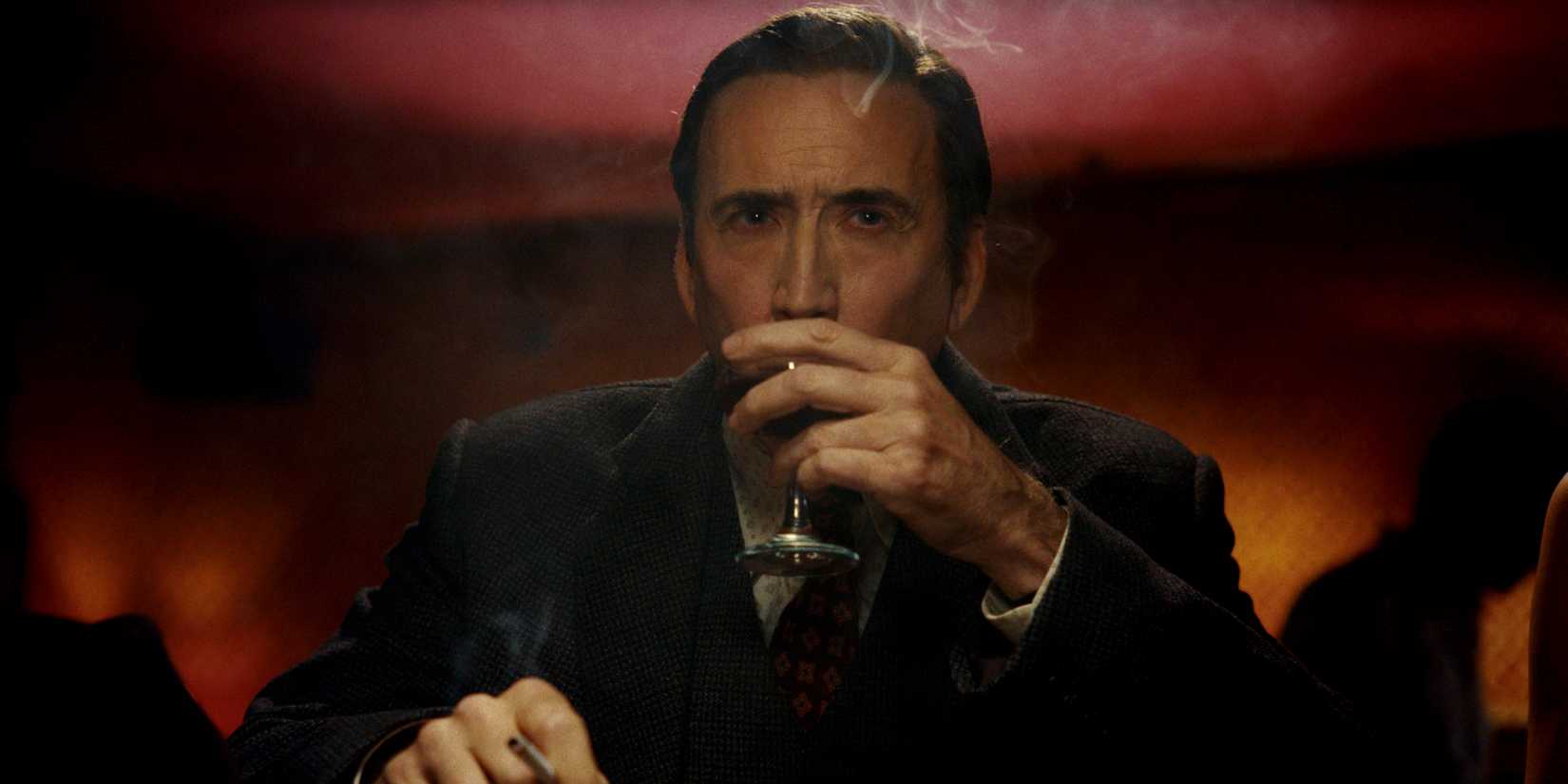 Nicolas Cage taking a drink in Spider-Noir