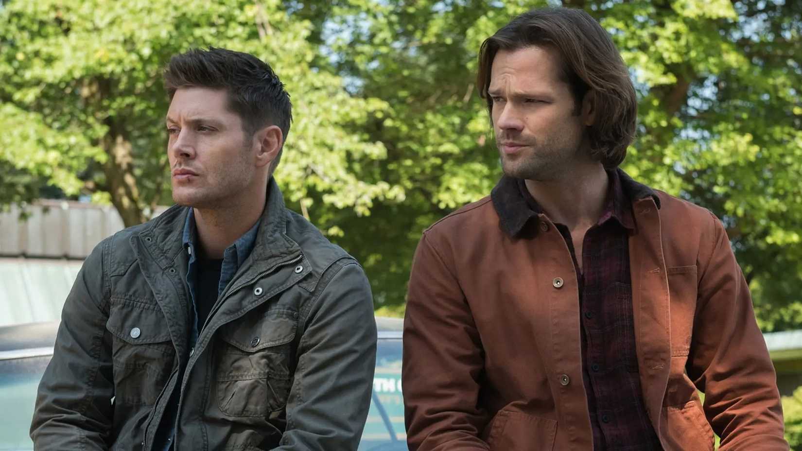 Supernatural's Sam And Dean leaning on a car
