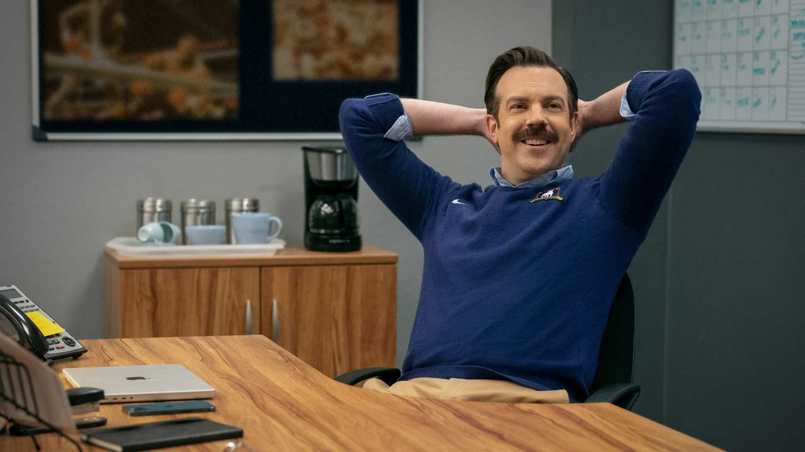 Ted Lasso sitting in his chair