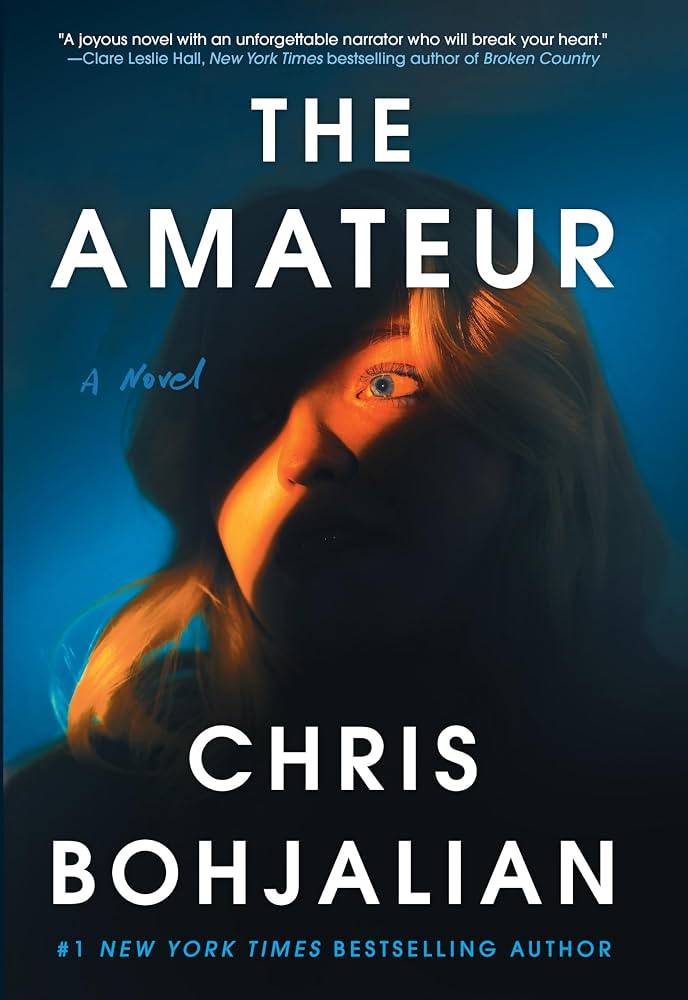 The Amateur book cover by Chris Bohjalian shows a woman whose face is only partially lit up