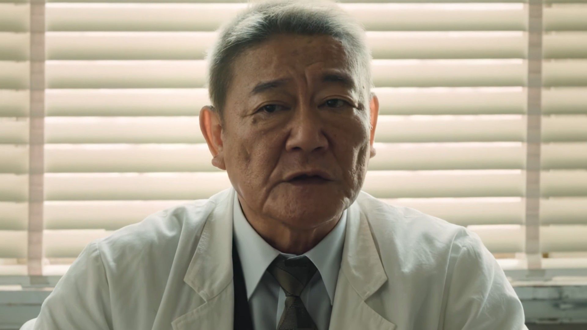 The doctor is sharing something in Godzilla Minus Zero
