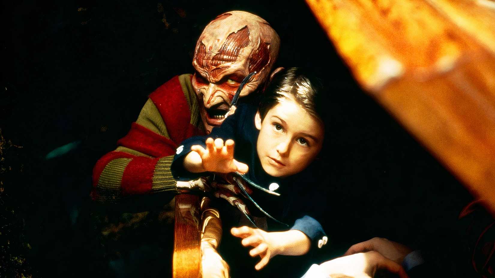 The Entity Freddy Krueger grabs Dylan (Miko Hughes) in Wes Craven's New Nightmare (1994)