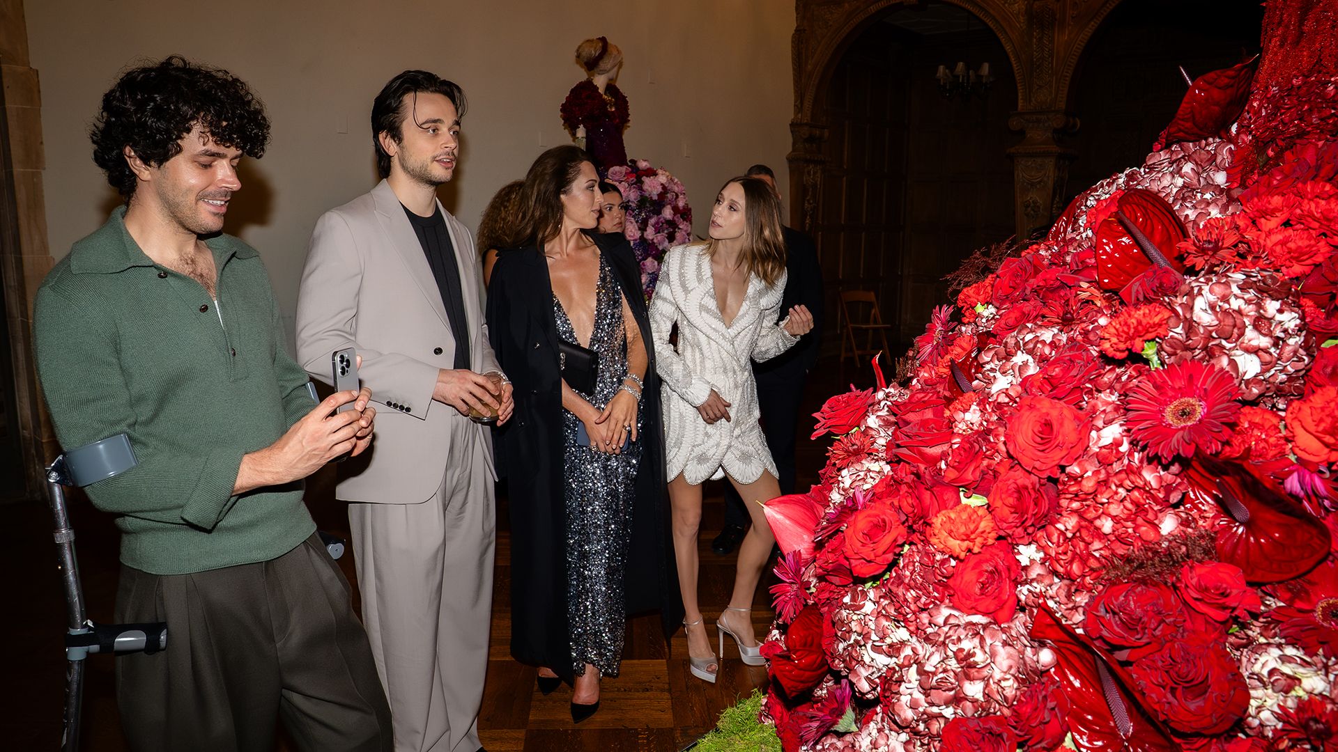 the-gilded-cast-cast-looking-at-flower-outfit Art Imitates The Gilded Age At Greystone Mansion In Beverly Hills