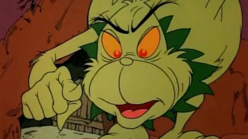 The Grinch pointing at his head in Halloween Is Grinch Night.