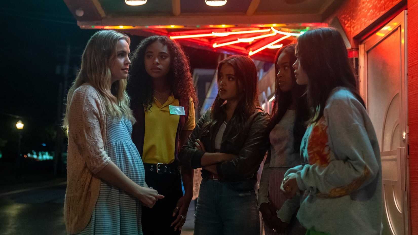 The liars look worried while standing outside the theater in Pretty Little Liars: Original Sin