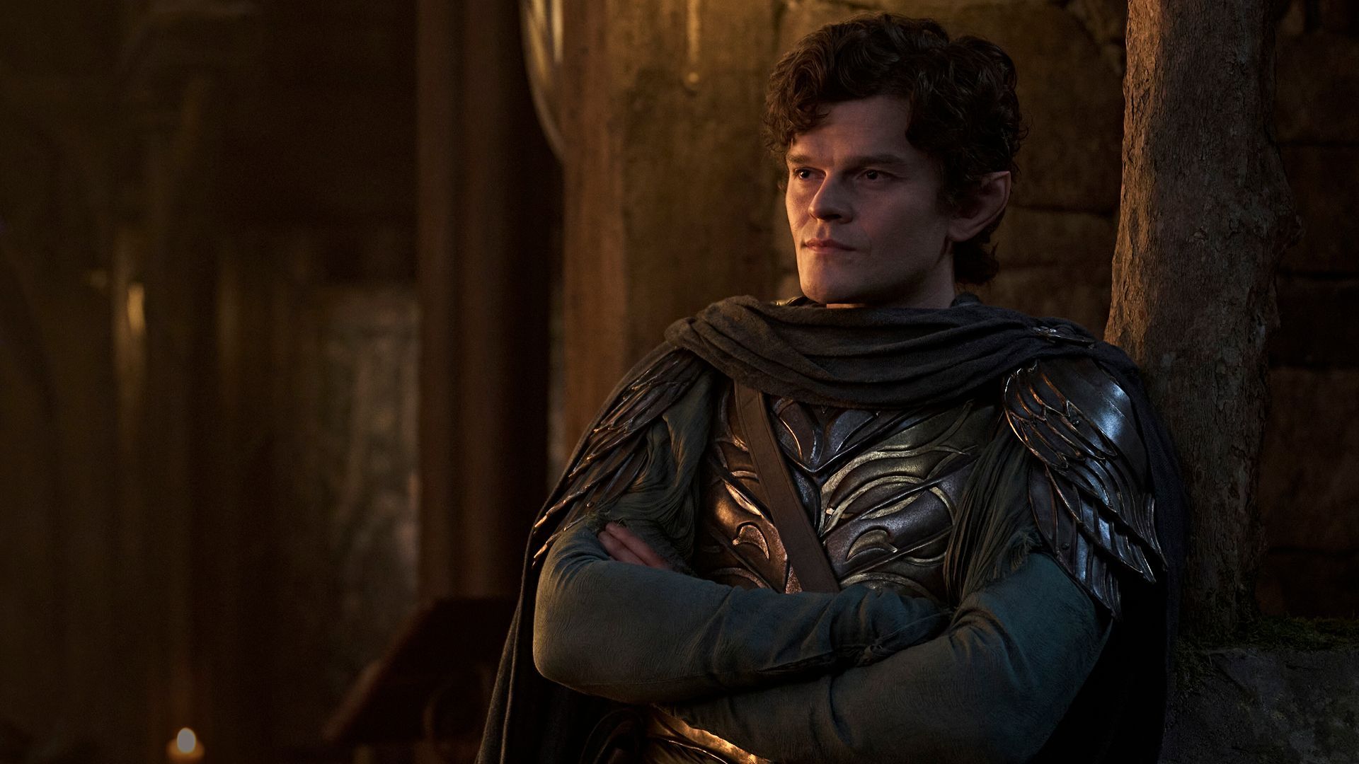 Elrond leaning back in a suit of armor in Rings of Power