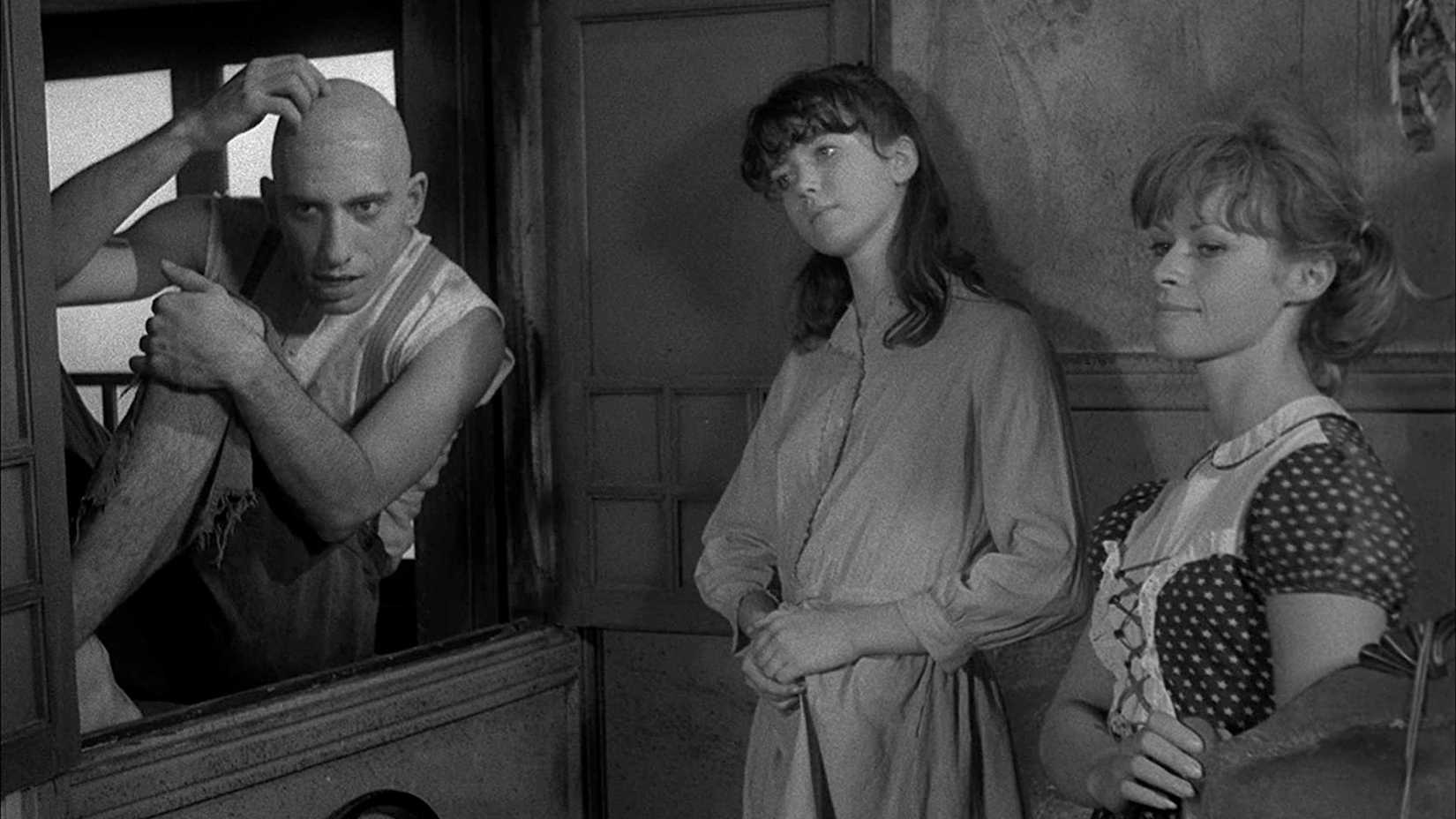 The Merrye children standing together in Spider Baby