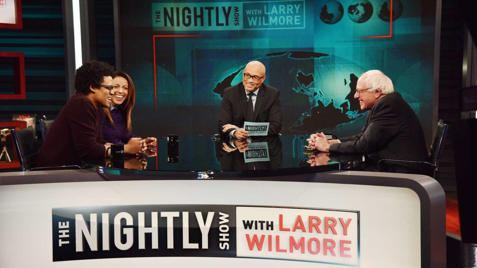 THE NIGHTLY SHOW WITH LARRY WILMORE, (from left): Jordan Carlos, Grace Parra, host Larry Wilmore, Bernie Sanders 'Sexist Donald Trump & Bernie Sanders Chat', (aired Jan. 5, 2016).