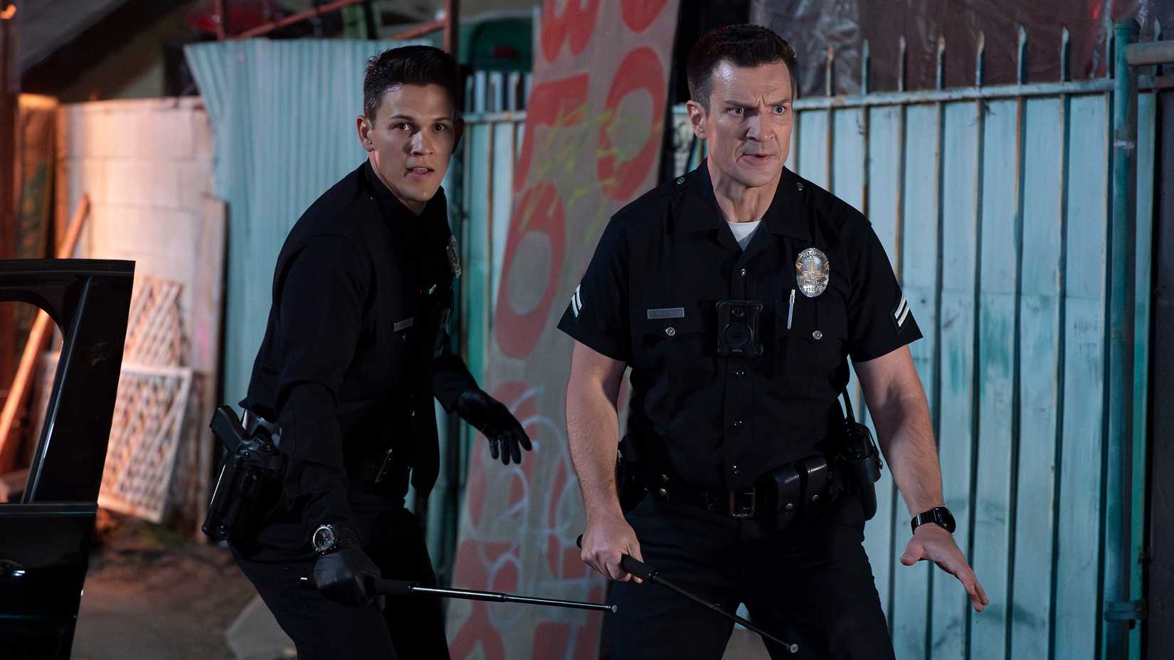 Still of Nathan Fillion John Nolan and David Gridley as Connor Craig in The Rookie season 7.