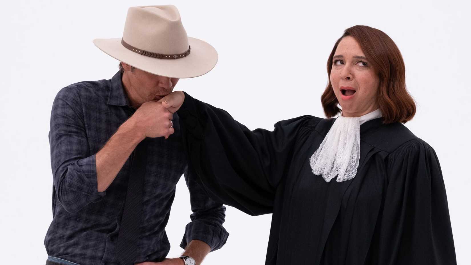Timothy Olyphant kissing Judge Gen's Hand in The Good Place