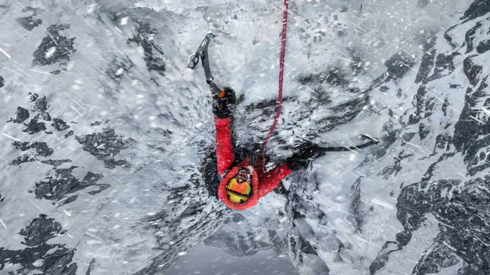 Guy climbing a mountain in The Last First: Winter K2