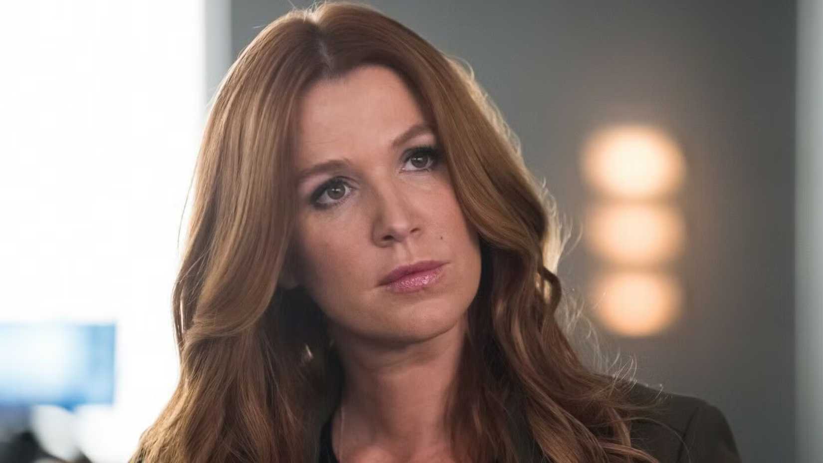 Poppy Montgomery as Detective Carrie Wells in Unforgettable