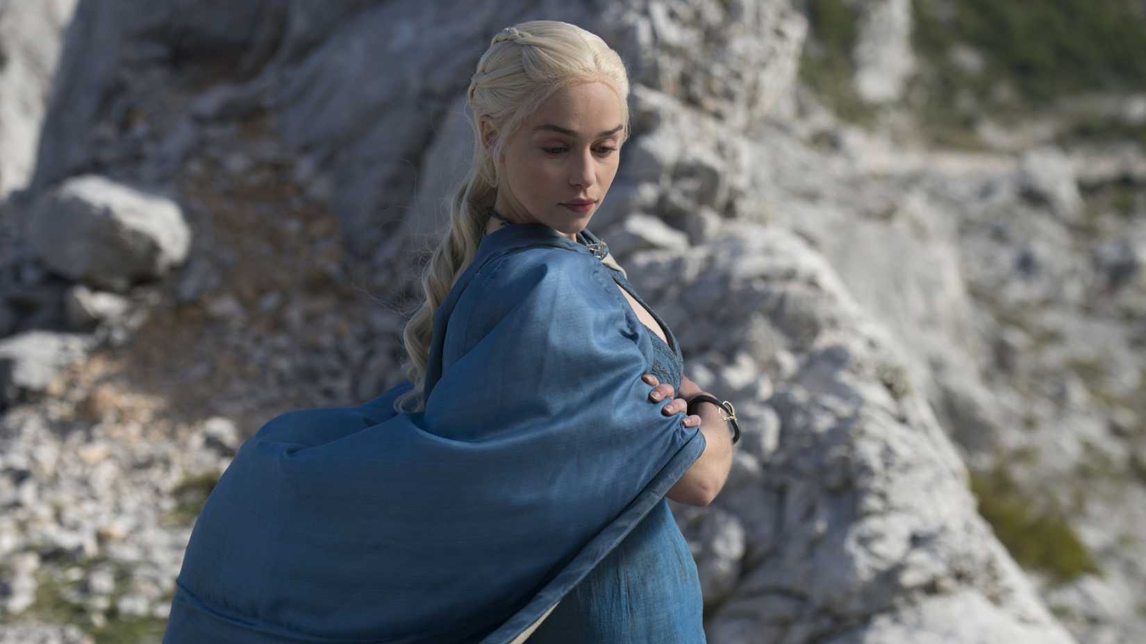 Emilia Clarke as Daenerys Targaryen wearing blue robes