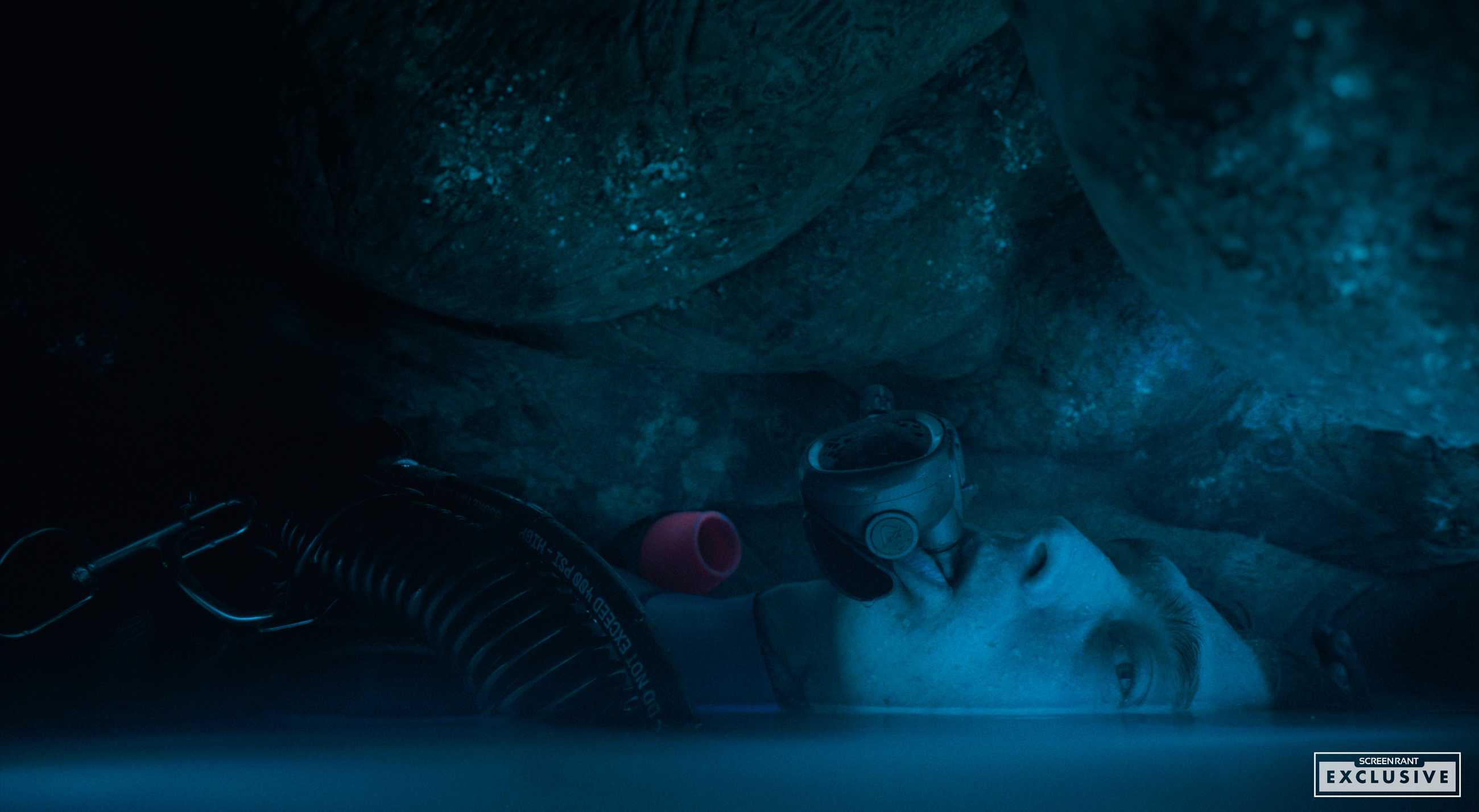 Austin Abrams floating in water inside the whale stomach set in Whalefall