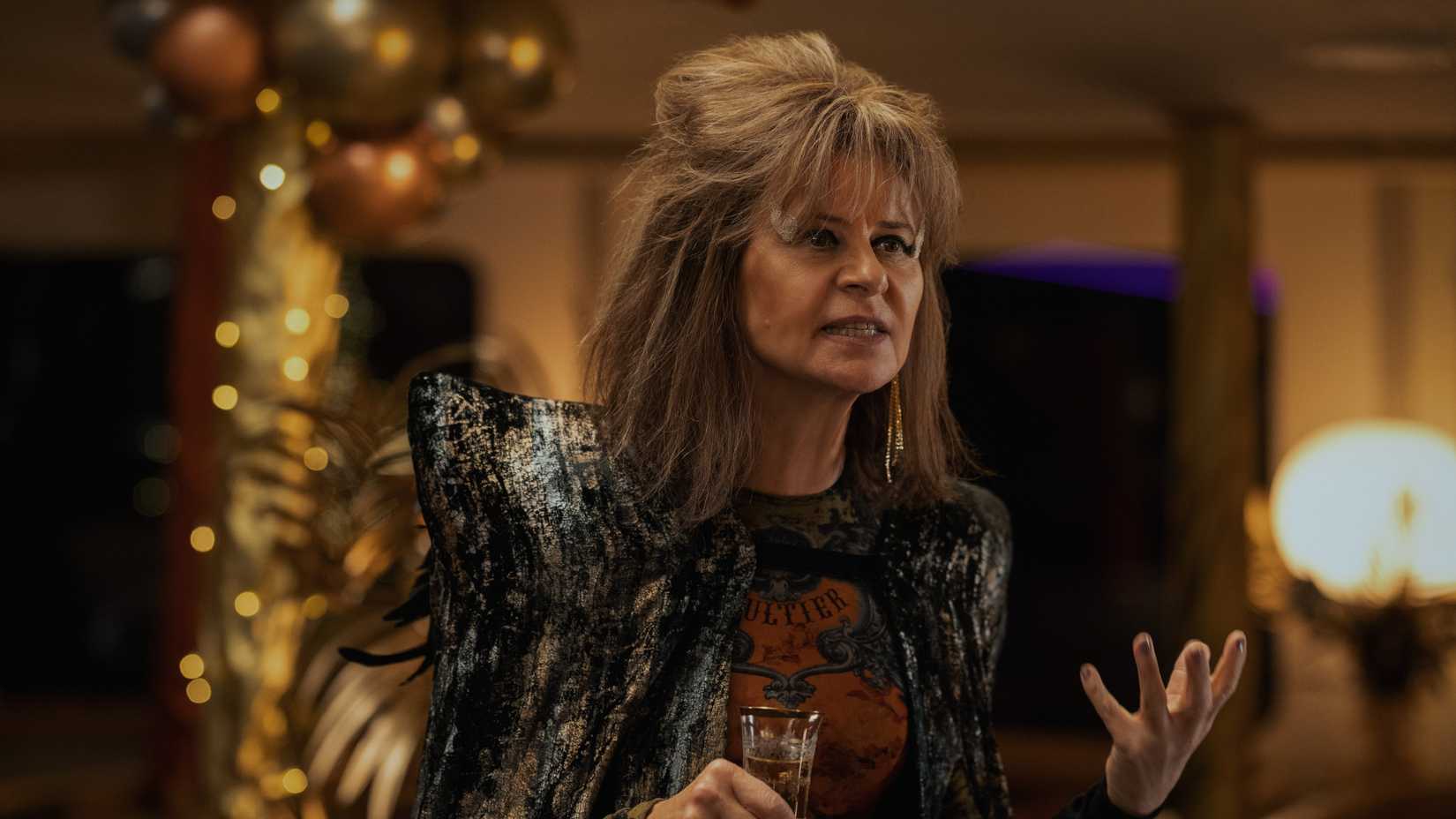 Tracey Ullman's Zelda Southport at a party in Ted Lasso