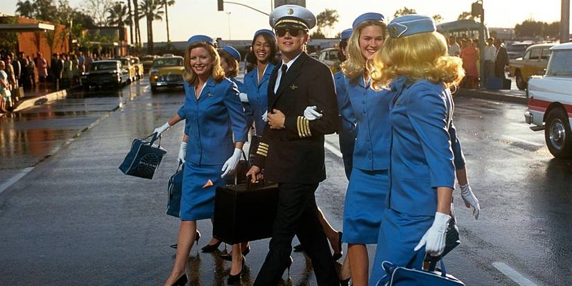 Leonardo DiCaprio as Frank Abagnale Jr. leading a group of flight attendants in Catch Me If You Can