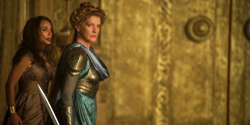 Renee Russo's Frigga holds a sword in Thor: The Dark World