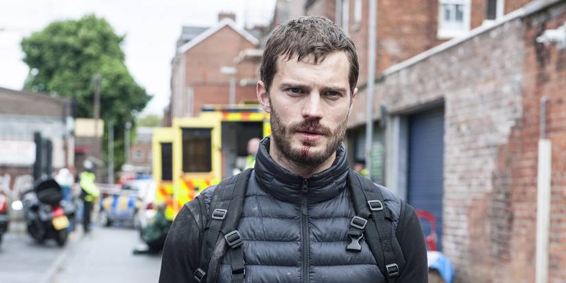 Jamie Dornan as Paul Spector walking with a bloody nose in The Fall