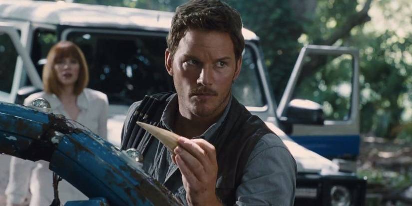 Chris Pratt Holding A Dino Tooth Looking Displeased