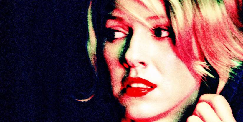 Naomi Watts as Betty Elms/Diane Selwyn looking over her shoulder in fear in Mulholland Drive