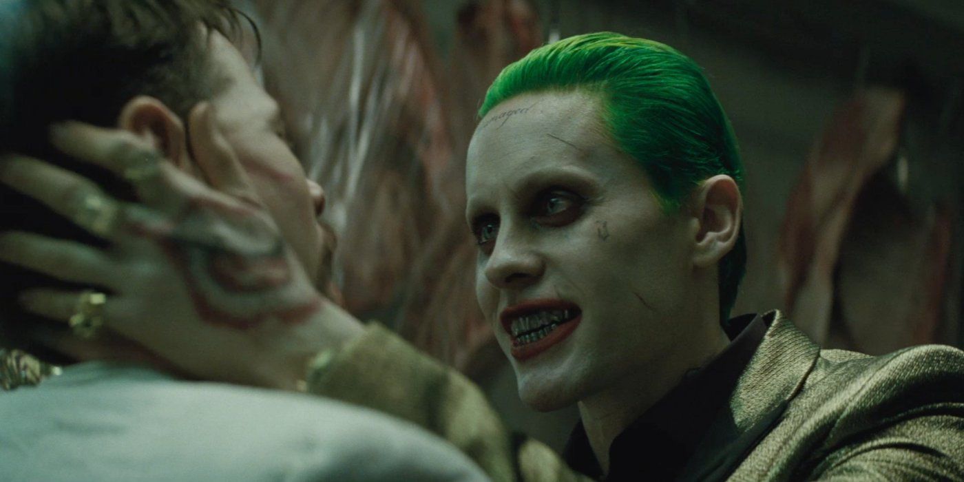 The Joker menaces a person from Suicide Squad