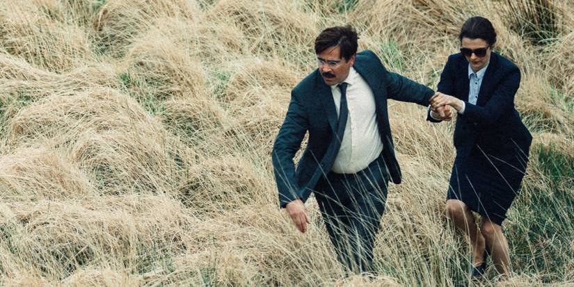 David (Colin Farrell) and Short Sighted Woman (Rachel Weisz) running through high grᴀss in The Lobster