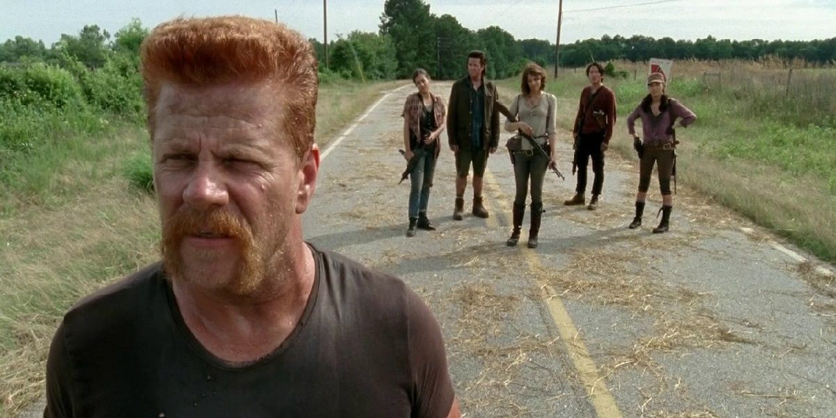 Abraham standing in front of the rest of the group in The Walking Dead