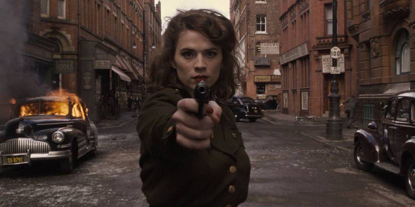 Hayley Atwell as Peggy Carter shoots directly toward the screen