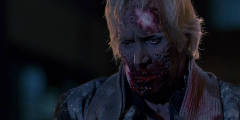 A man with a bloody face from Cronos.