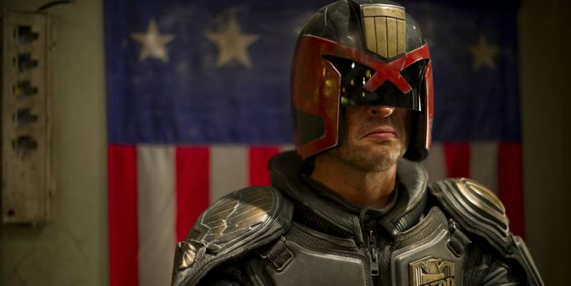 Karl Urban in Dredd 2012 with an American flag behind him
