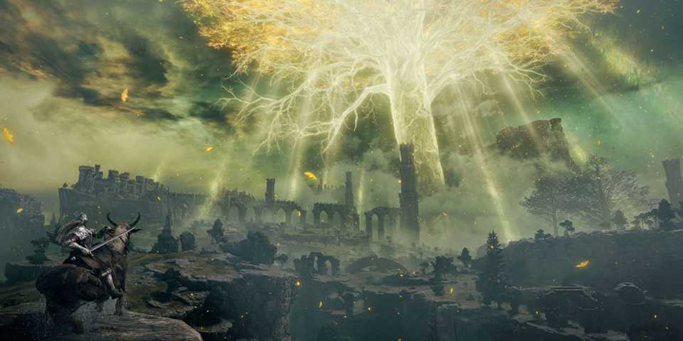 The player looking at the Erdtree in the distance in Elden Ring.