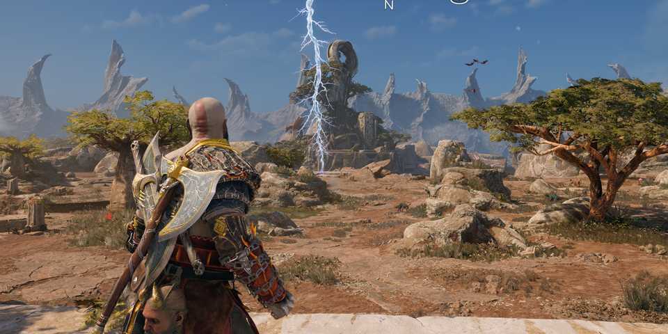 Kratos looking at a bolt of frozen lightning in God of War Ragnarok.