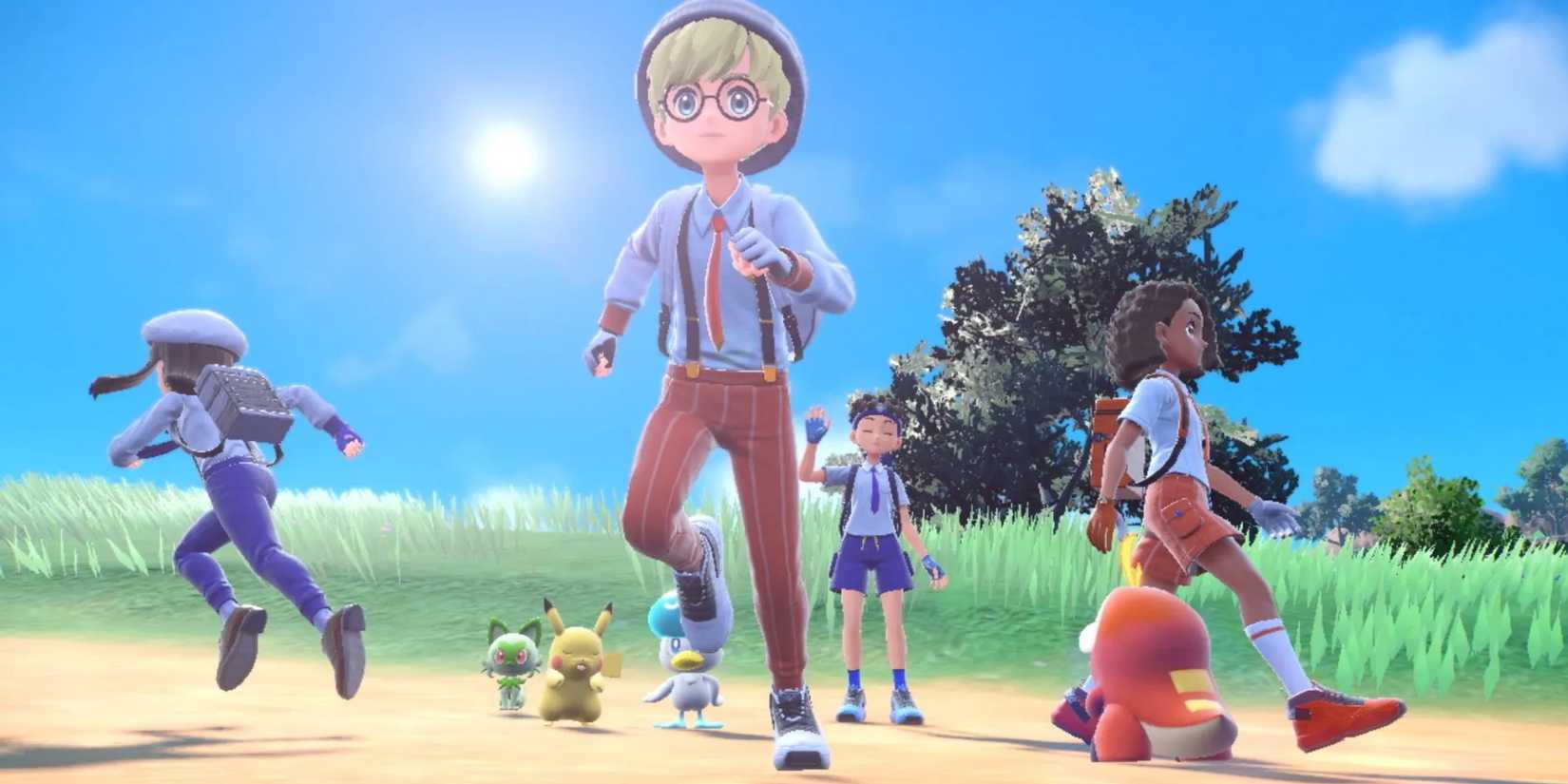 Four players running across the open world in Pokemon Scarlet.