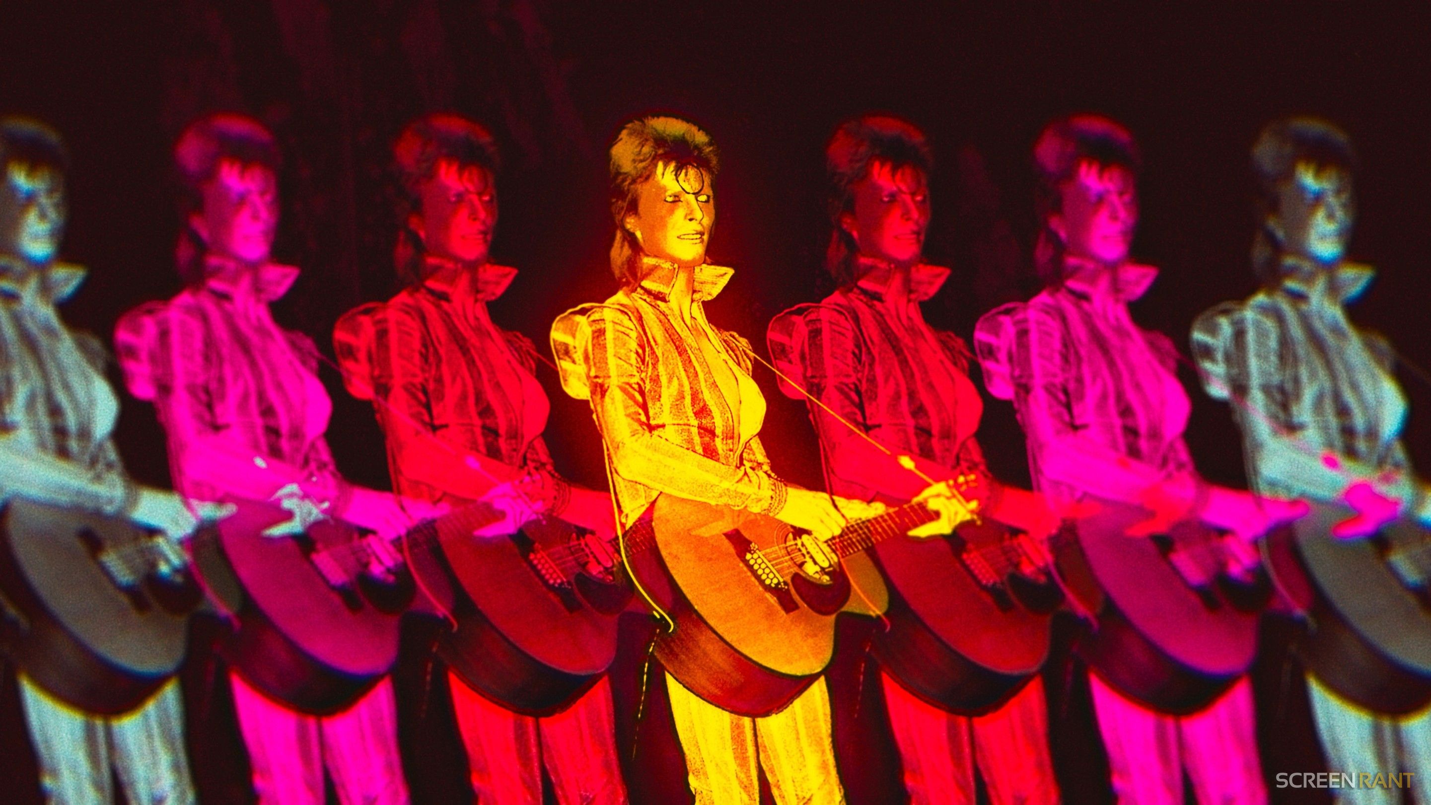 David Bowie performing as Ziggy Stardust with a guitar under multi-colored neon lights, representing the 2026 streaming surge of Starman.