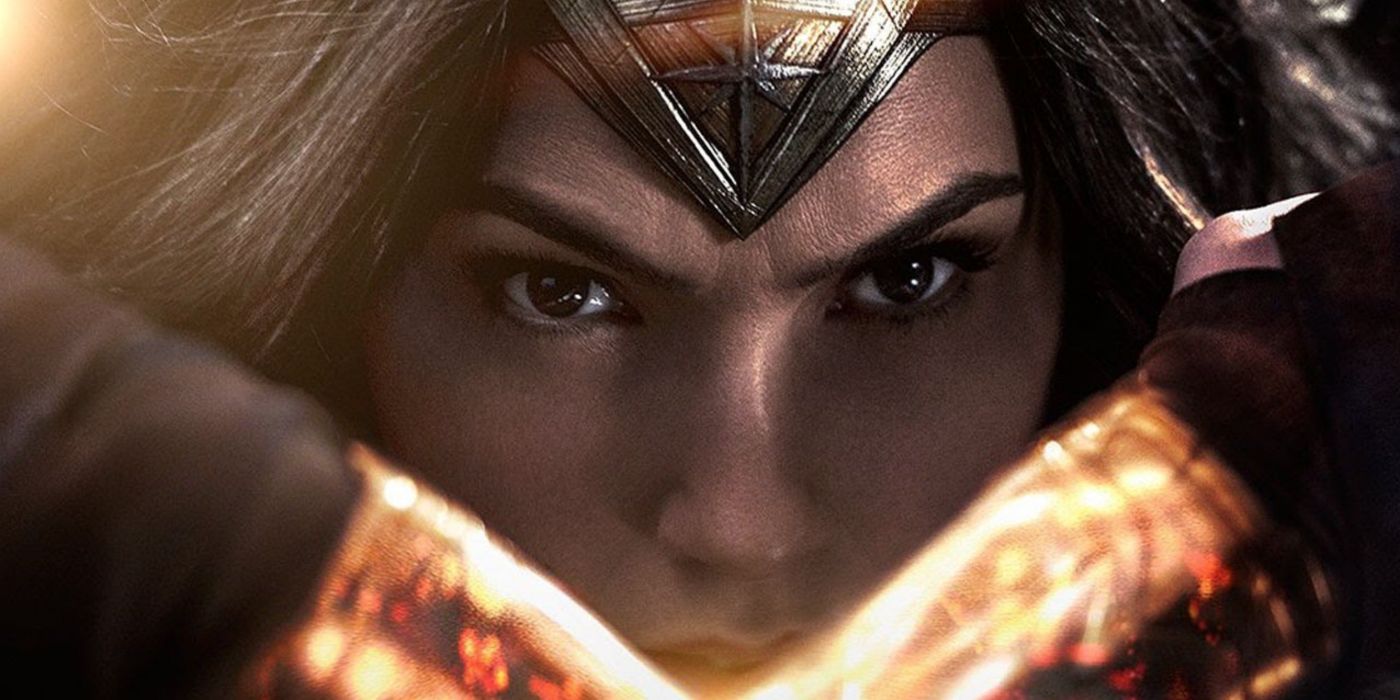 Gal Gadotcrosses her gauntlets in front of her face in Wonder Woman